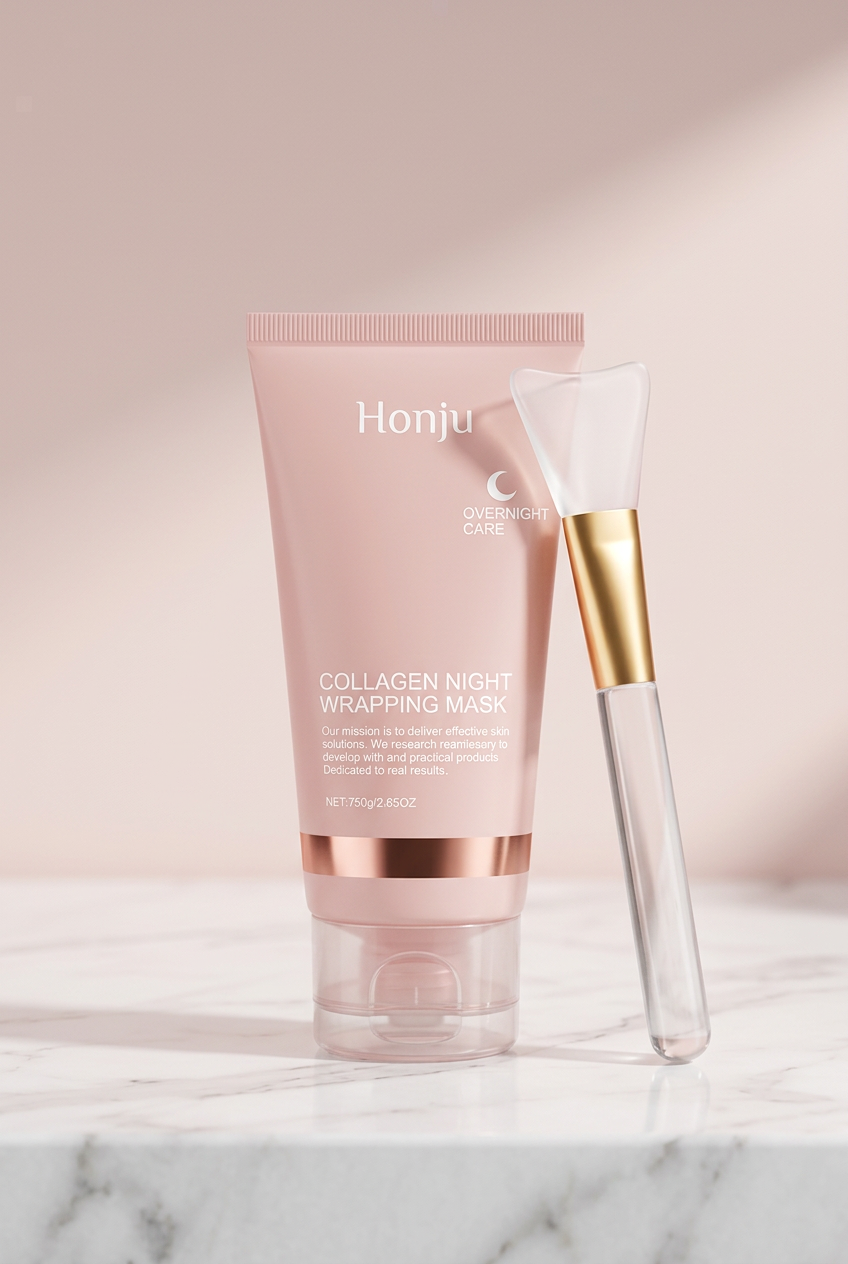 Honju collagen mask blush pink tube and clear gold-ferrule silicone brush on white marble, pale pink background