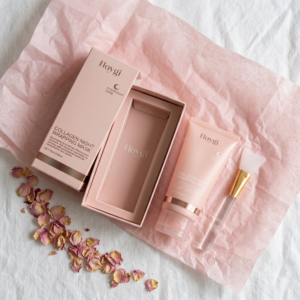 Honju Collagen Mask Set unboxed — blush pink box, tube, and brush on white with rose petals and tissue paper